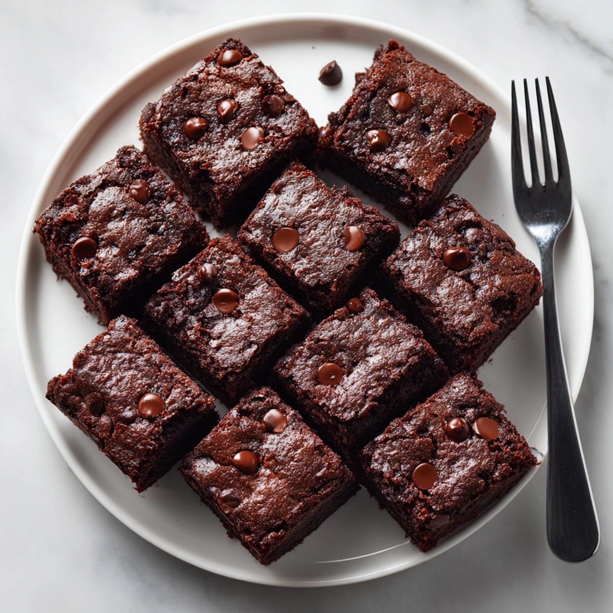 Gluten-free chocolate avocado brownies cooling in pan, ready to serve for dessert lovers.