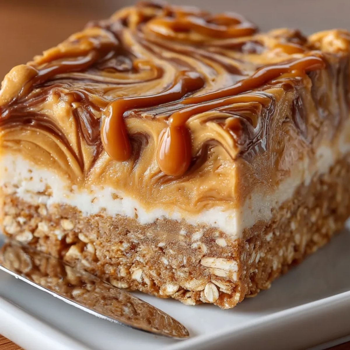 Freshly baked Peanut Butter Swirl Protein Bars sliced in a pan, golden edges visible