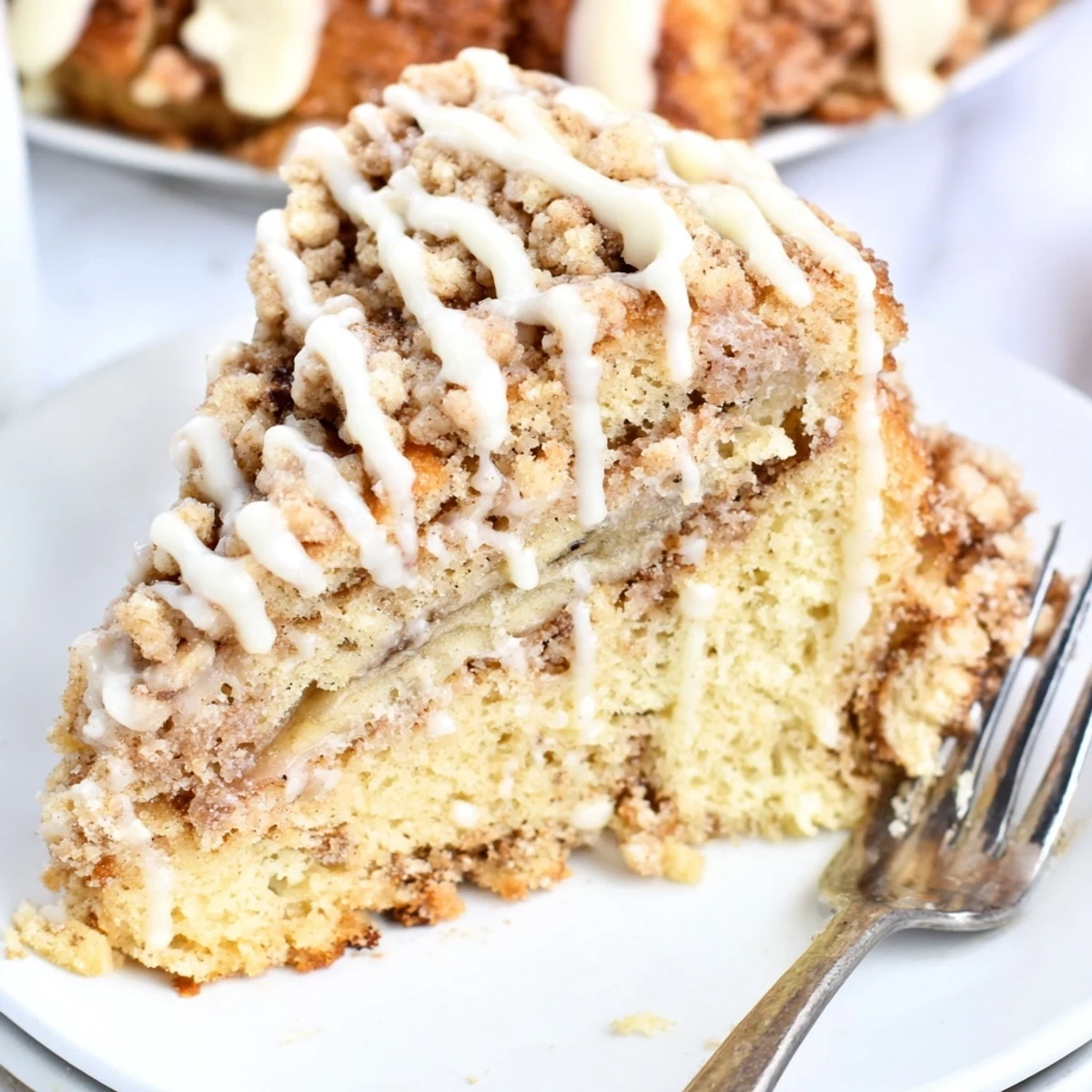 Moist banana cream coffee cake scones drizzled with sweet vanilla glaze.  