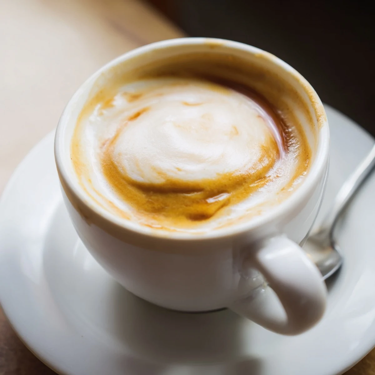 Savory onion latte topped with frothed milk, perfect for adventurous coffee lovers.  