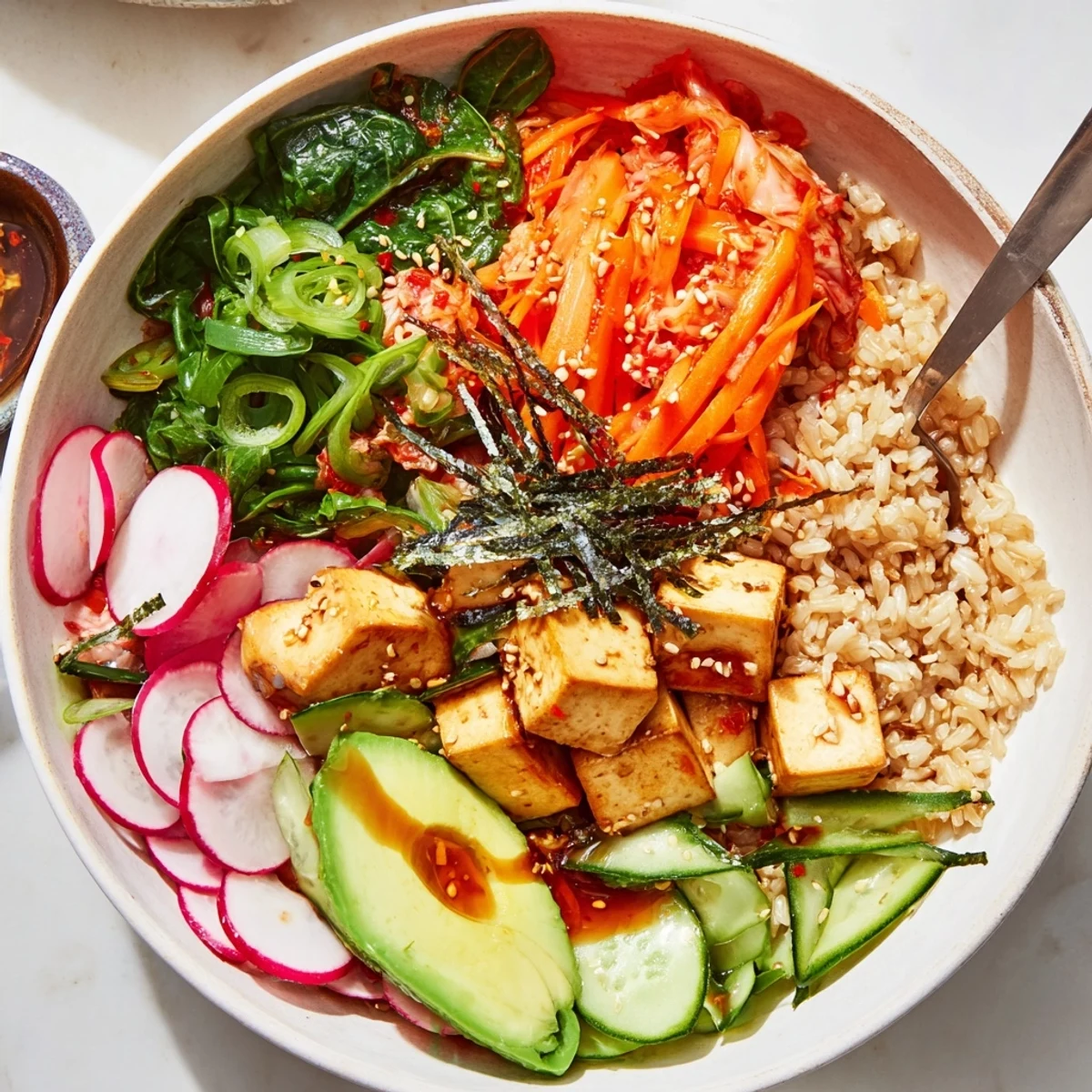 Vibrant Fermented Vegetable Bowl with kimchi, fresh greens, and savory dressing, perfect for lunch.  