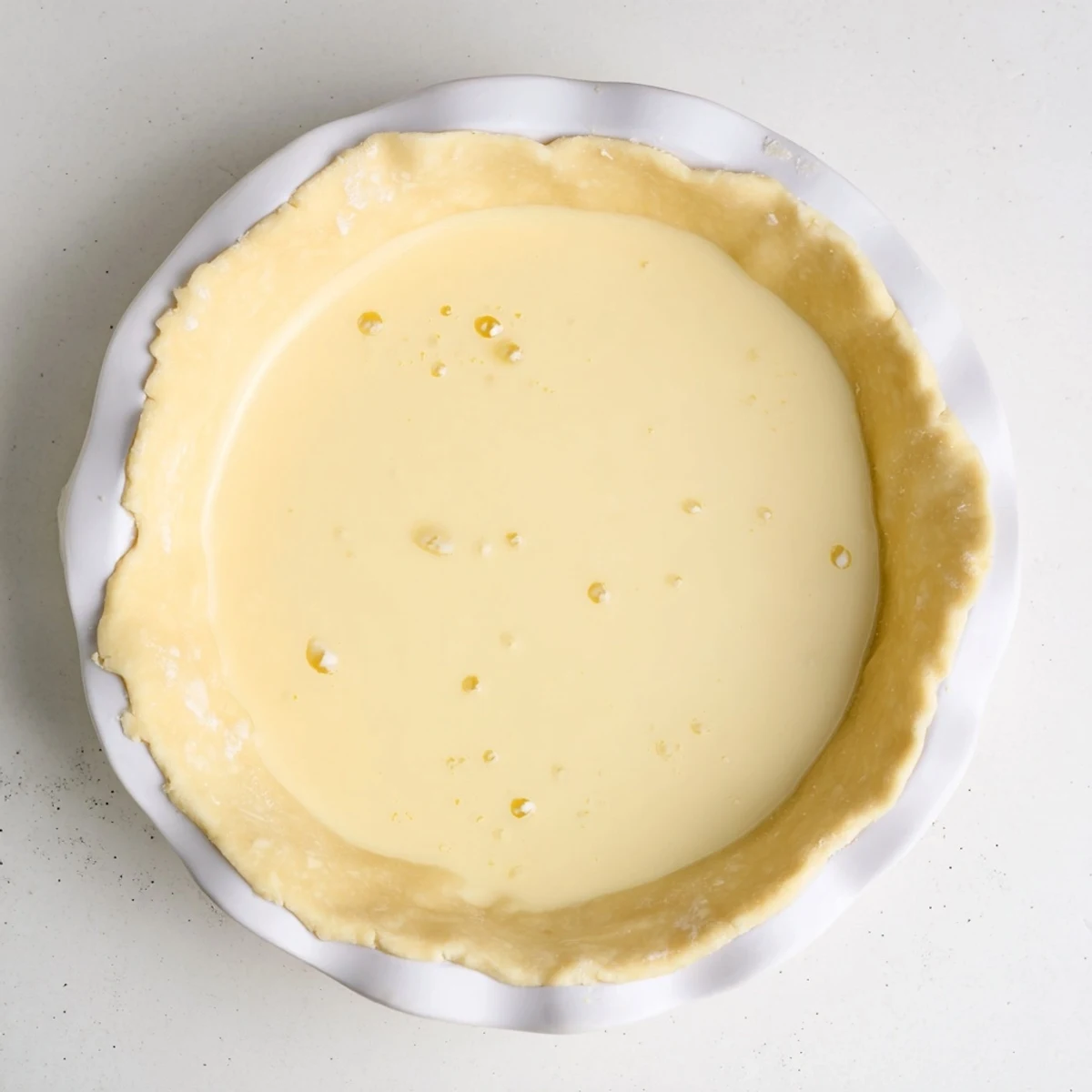 Cooling the delicate, custardy Water Pie after baking enhances its creamy, melt-in-your-mouth texture.