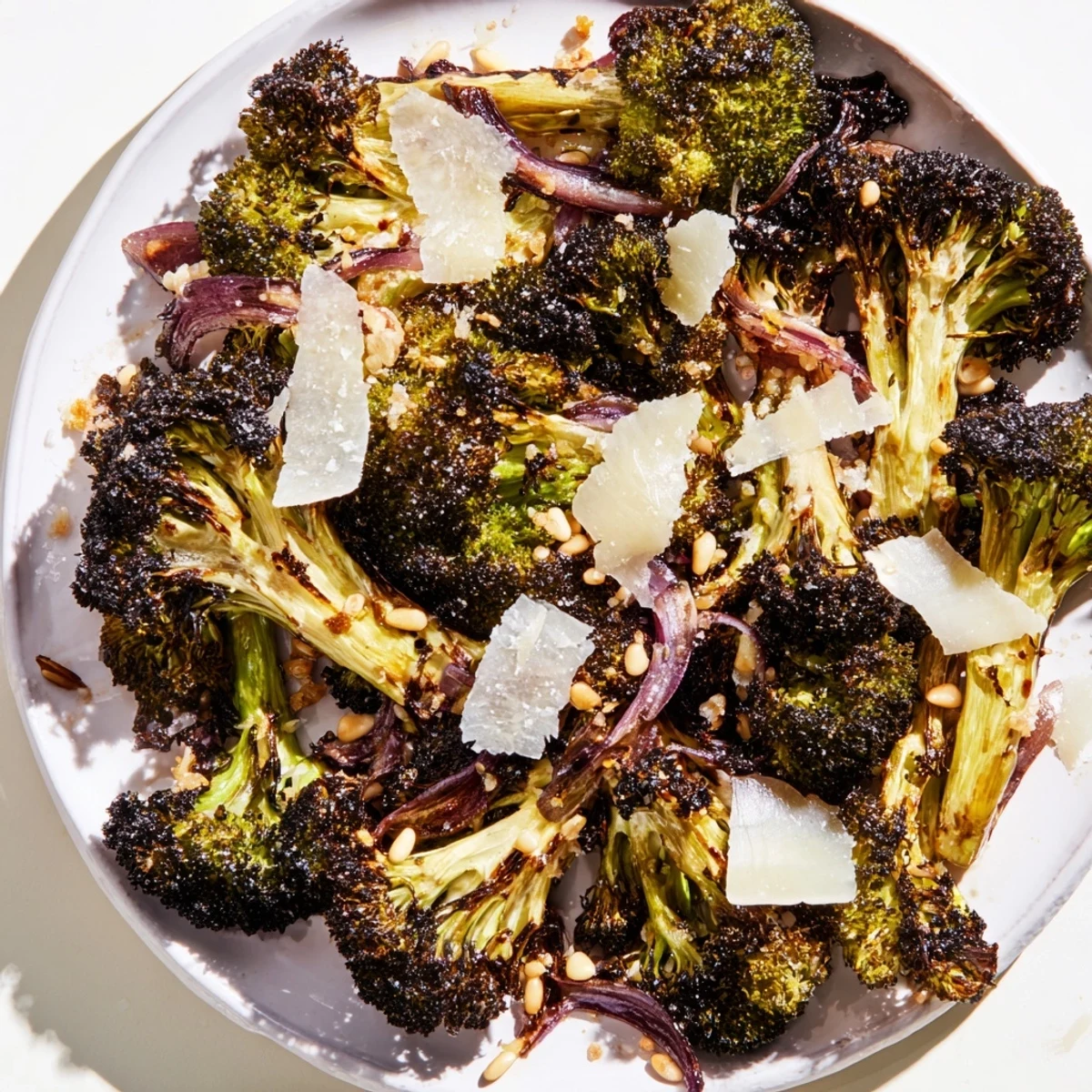 Tender, charred broccoli salad with vibrant colors and toasted nuts, a satisfying side.