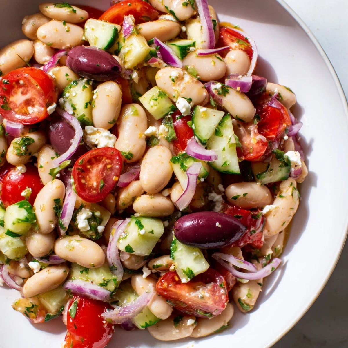 Freshly made white bean salad with a medley of chopped vegetables tossed in a tangy herb dressing.