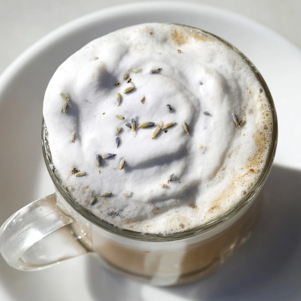 Fluffy whipped lavender foam tops a rich, creamy whipped lavender latte, a perfect coffee beverage.