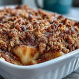 Warm Cinnamon Apple Crumble Pancake Bake, a layered breakfast casserole.