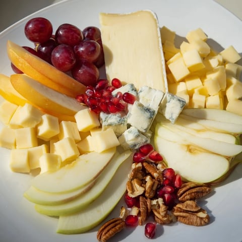 A visually stunning Winter Wonderland Snack Board overflowing with vibrant fruits and assorted cheeses.