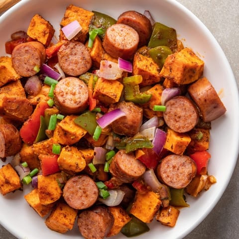 Close-up image shows the vibrant colors and textures of Cajun Sausage Hash.