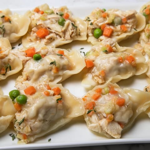 This Chicken and Dumplings Casserole shows a bubbling, savory dish just out of the oven, ready to serve.