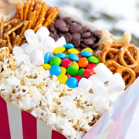 Imagine a vibrant Movie Night popcorn box display filled with colorful snack options.