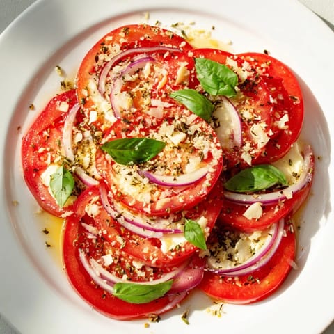 Warm, cheesy Speedy Feta-Free Tomato Bake with soft tomatoes, perfect for a hearty vegetarian side.
