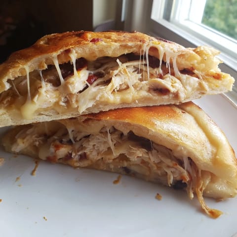 Golden-brown, cheesy Leftover Pizza Grilled Cheese served hot, perfect for a quick lunch.