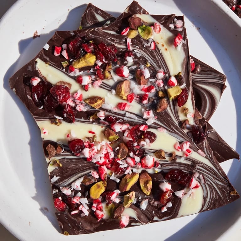 Indulge in this homemade Holiday Bark Shard Display featuring dark chocolate swirls and festive fixings.