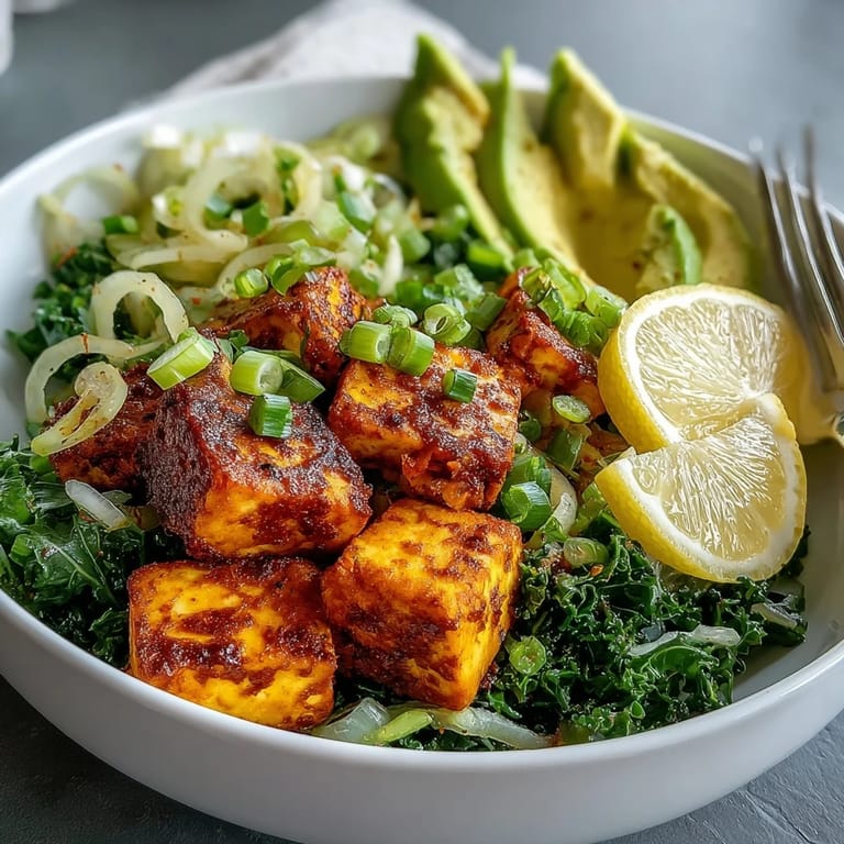 Close-up of a vegan Tofu Breakfast Bowl with avocado, kale, and golden tofu, ready for a healthy morning meal.